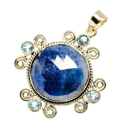 Round blue gemstone pendant with sterling silver scroll setting and clear blue side stones