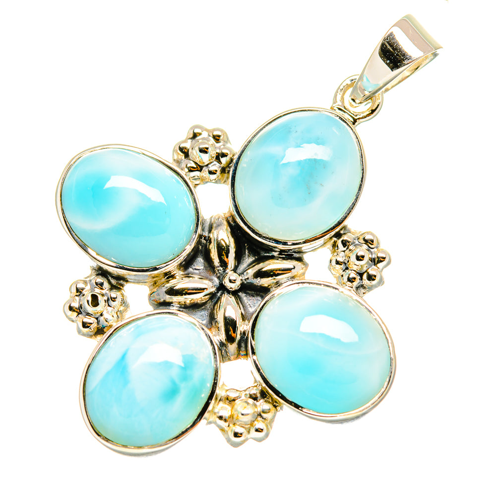 Sterling silver pendant with four round light-blue cabochons and decorative cross frame