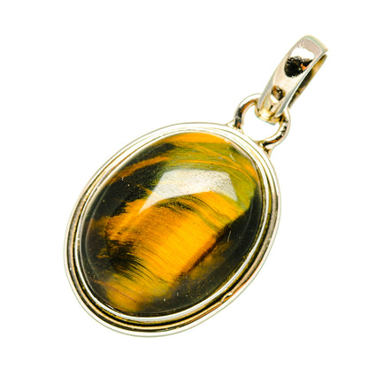 Tiger eye pendant in oval sterling silver bezel with gold-toned bail