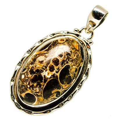 Sterling silver oval agate pendant with dark amber fossil stone in ornate bezel