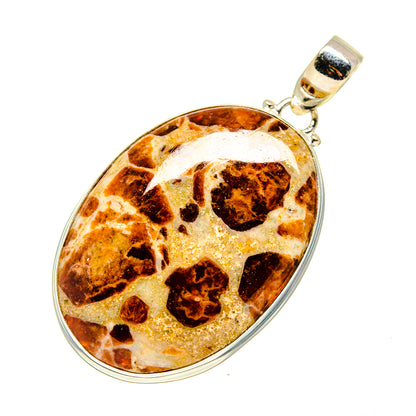 Muscovite pendant in round sterling silver bezel with mottled amber and white stone