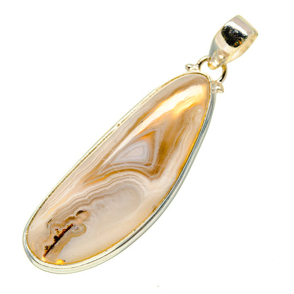 Sterling silver teardrop agate pendant with gold-toned border and loop bail