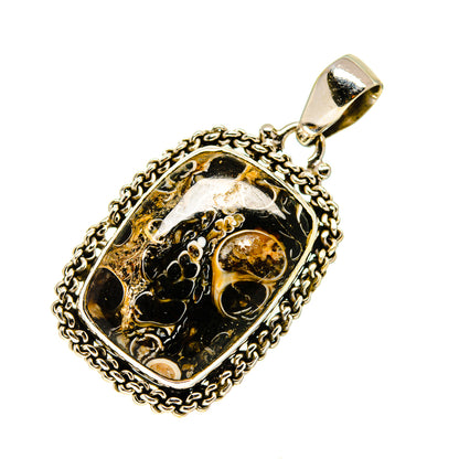 Sterling silver turritella agate pendant with ornate oval bezel and loop bail