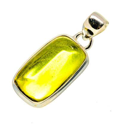 Quartz pendant in silver setting with bright green polished stone cabochon