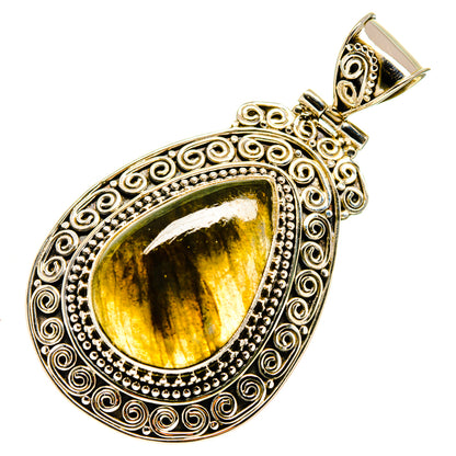 Labradorite teardrop pendant in ornate sterling silver setting with yellow-gold flash