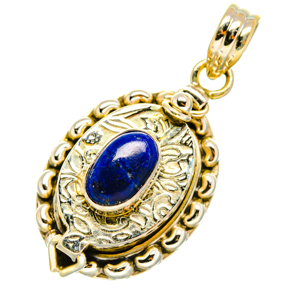 Lapis lazuli pendant with ornate oval silver bezel and blue cabochon, with chain bail