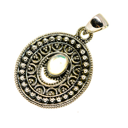 Sterling silver opal pendant, round filigree frame with iridescent oval center