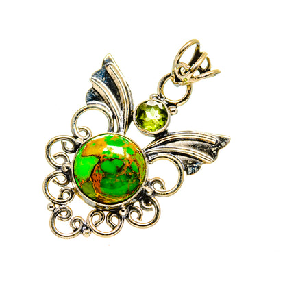 Round gemstone pendant with green stone center, leaf filigree and dangling peridot accents