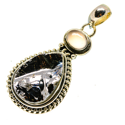 Sterling silver pendant with rough black teardrop stone, framed top loop and round light stone