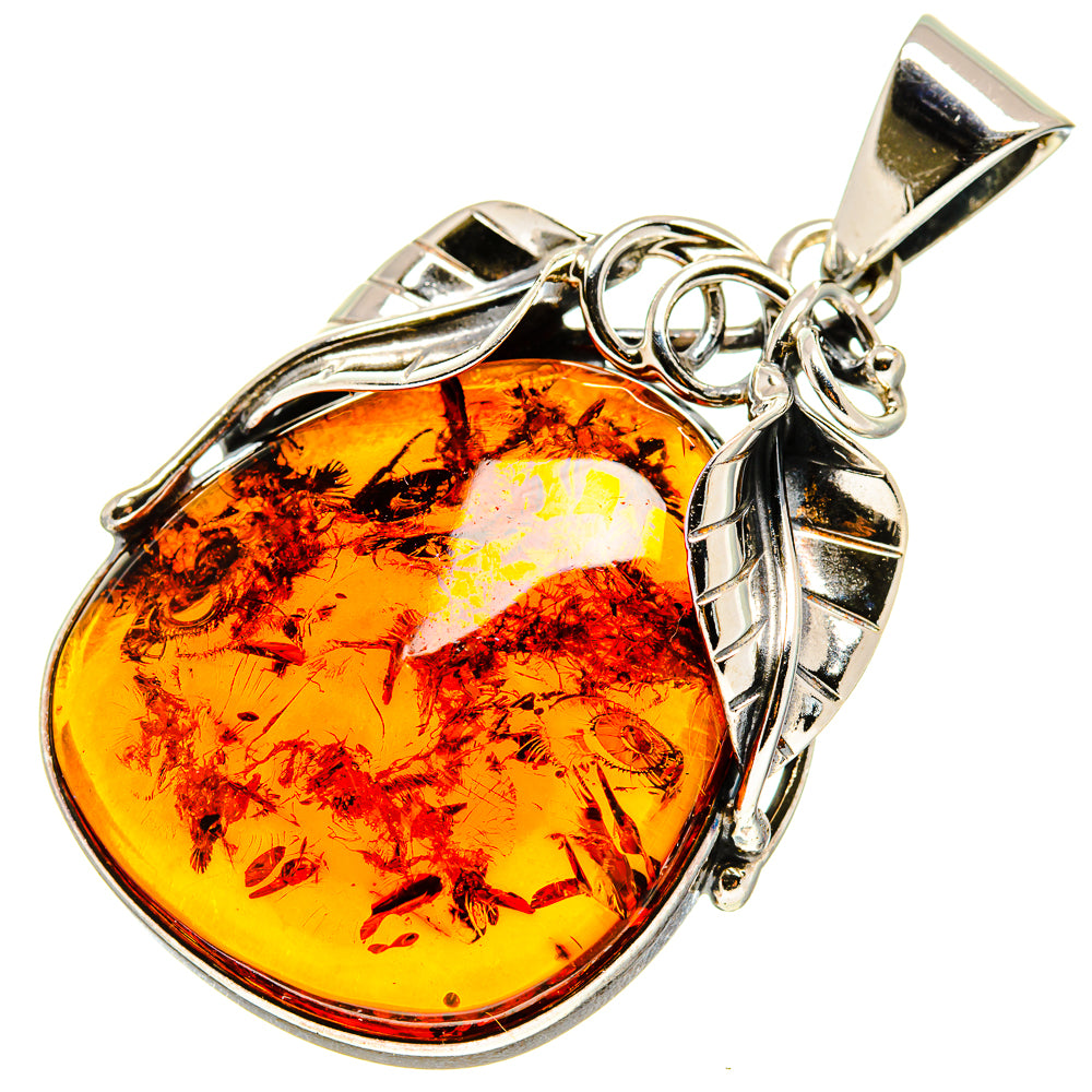 Oval amber pendant with 925 sterling silver setting and loop bail, angled view