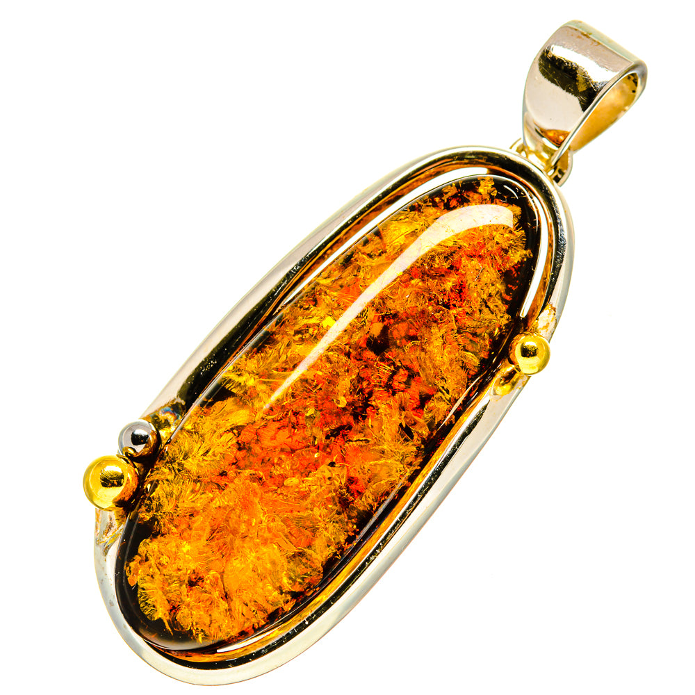 Oval amber pendant with sterling silver frame and gold bail