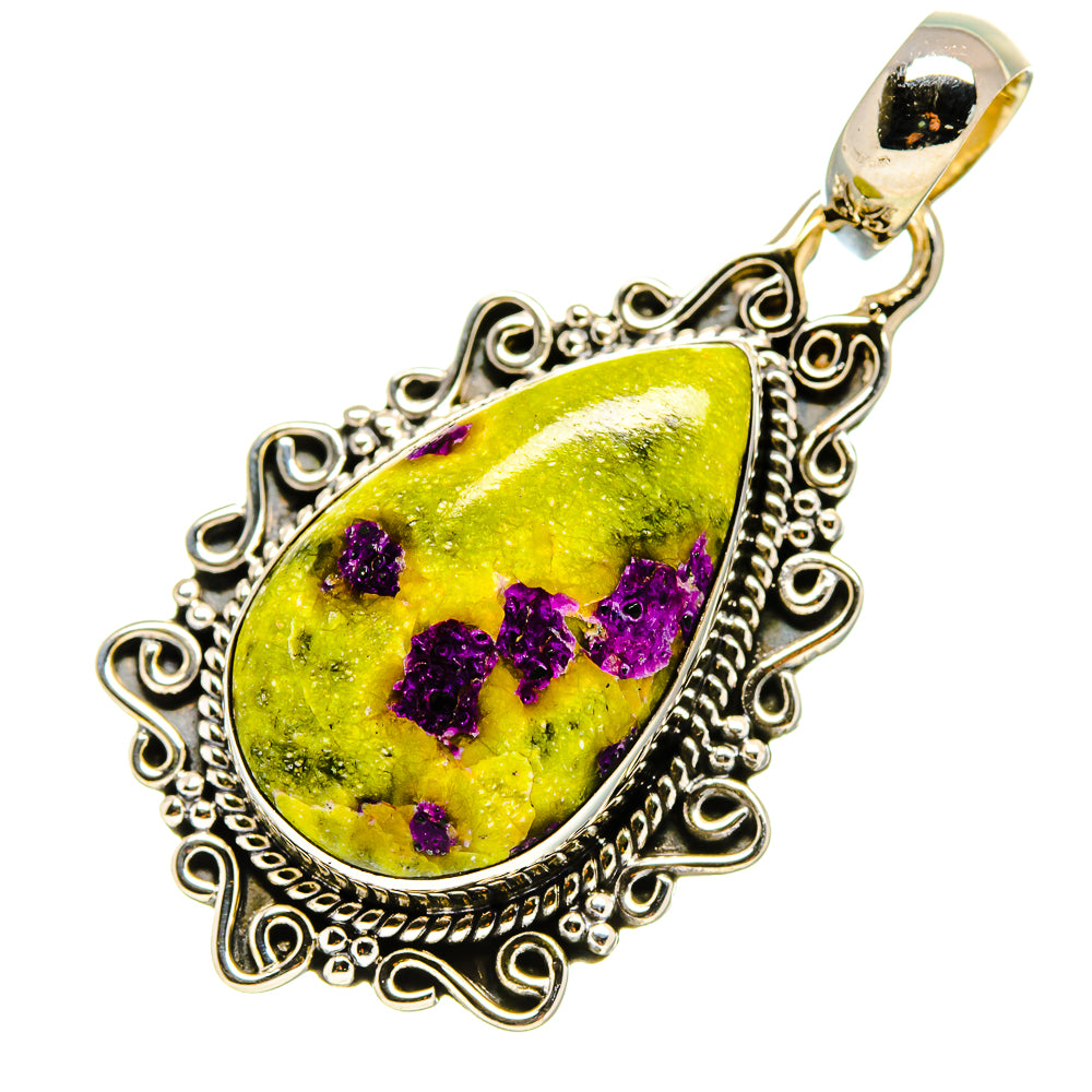 Sterling silver teardrop pendant with ornate filigree border, green center with purple crystals