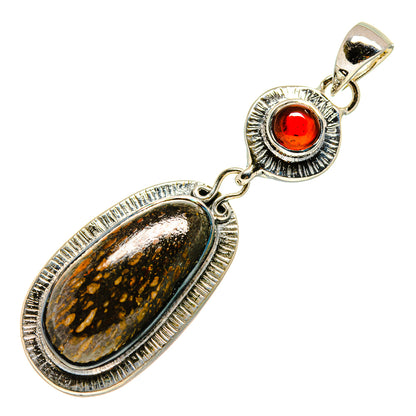 Sterling silver pendant with oval fossil-style stone, red garnet cabochon, bail loop