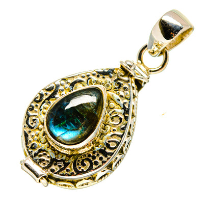 Ornate 925 sterling silver pendant with blue-green labradorite oval cabochon bail
