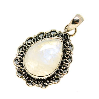 Oval moonstone pendant in ornate silver filigree with top loop bail