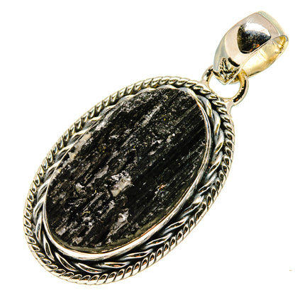 Oval black tourmaline pendant with ornate silver rope border and loop bail