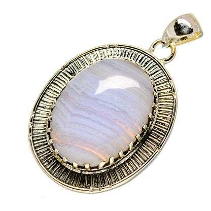 Sterling silver pendant with oval blue lace agate cabochon and ridged bezel, top bail