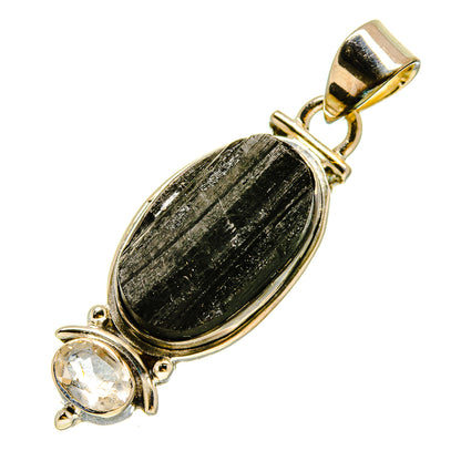 Oval dark stone pendant with clear round crystal, gold-tone bail and silver setting