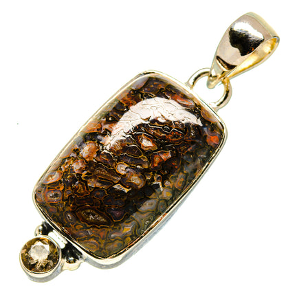 Sterling silver pendant with smoky dark brown stone and two round accent gems