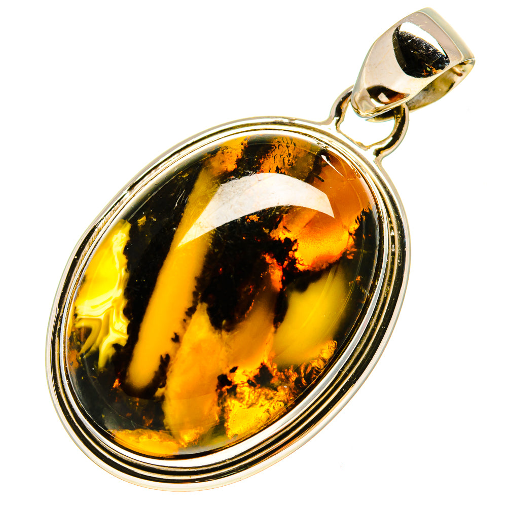 Oval jasper pendant with swirling amber, black, and gold stone in silver frame
