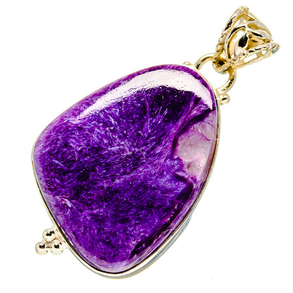Purple charoite teardrop pendant with ornate gold-tone bail, silver edging