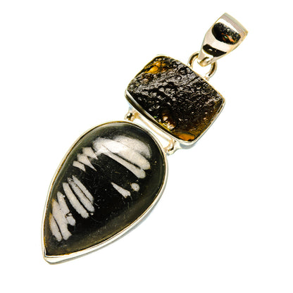 Sterling silver pendant with black teardrop stone, chrysanthemum-like pattern, and gold cap