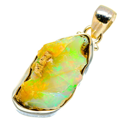 Rough opal pendant with bail and bezel, yellow-green iridescent stone in silver frame