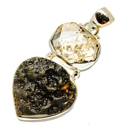 Heart-shaped sterling silver pendant with clear Herkimer diamond and black tektite