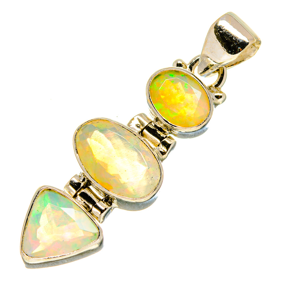 Sterling silver opal pendant with three faceted stones, gold-toned bail at top