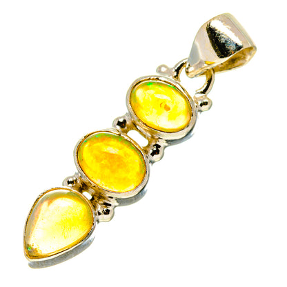 Sterling silver opal pendant with three oval cabochon opals and top bail, yellow