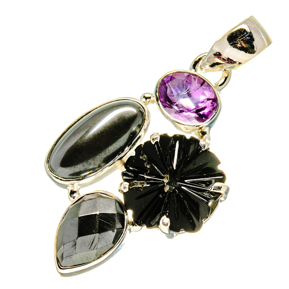Sterling silver pendant with oval amethyst purple stone and black faceted stones