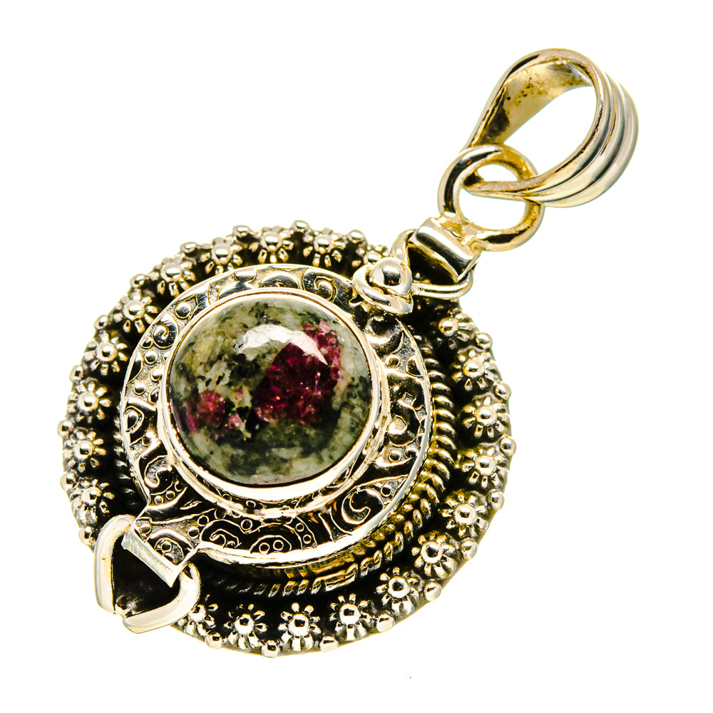 Silver statement pendant with red-green speckled round cabochon, filigree border and loop