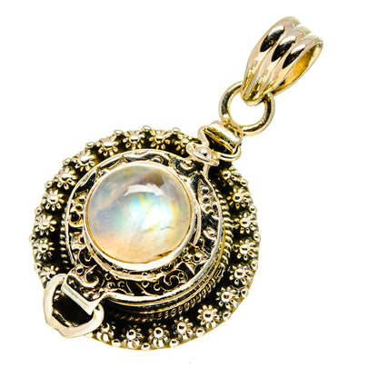 Moonstone pendant with ornate filigree and faceted stone center, metallic hanging bail