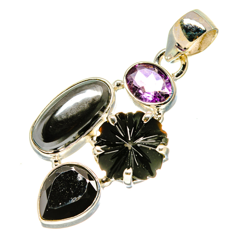 Sterling silver pendant with purple oval gemstone, black oval accents, and flower-like inlay