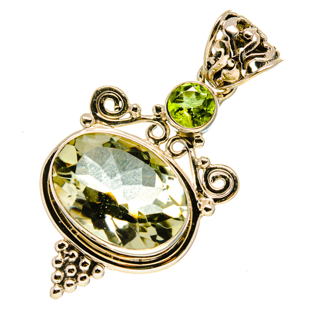 Oval green faceted gemstone pendant in ornate sterling silver setting with drop stone