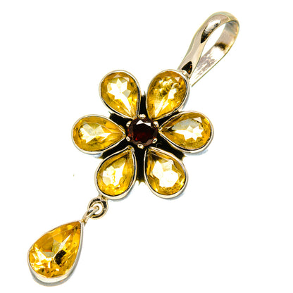 Sterling silver flower pendant with yellow faceted petals, dark center, teardrop drop.