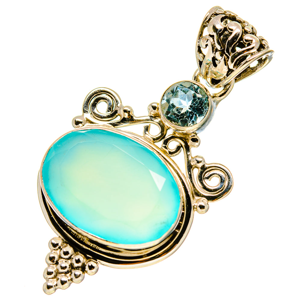 Sterling silver pendant with oval aqua chalcedony and round blue topaz accents, filigree