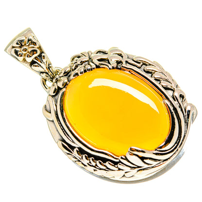 Sterling silver moonstone pendant with yellow oval cabochon and filigree border