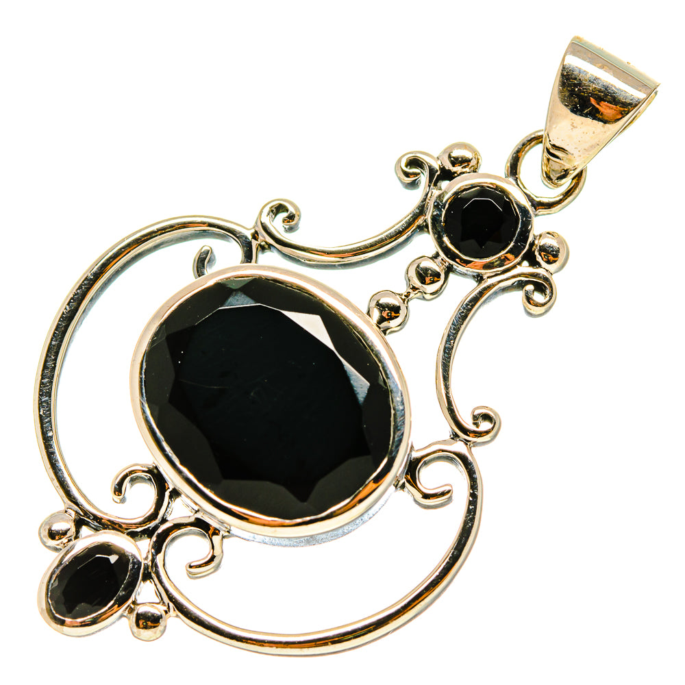 Black onyx pendant in 925 sterling silver with round black stone and ornate swirl