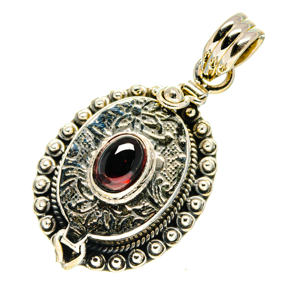 Garnet red poison pendant in ornate sterling silver with loop bail and etched halo