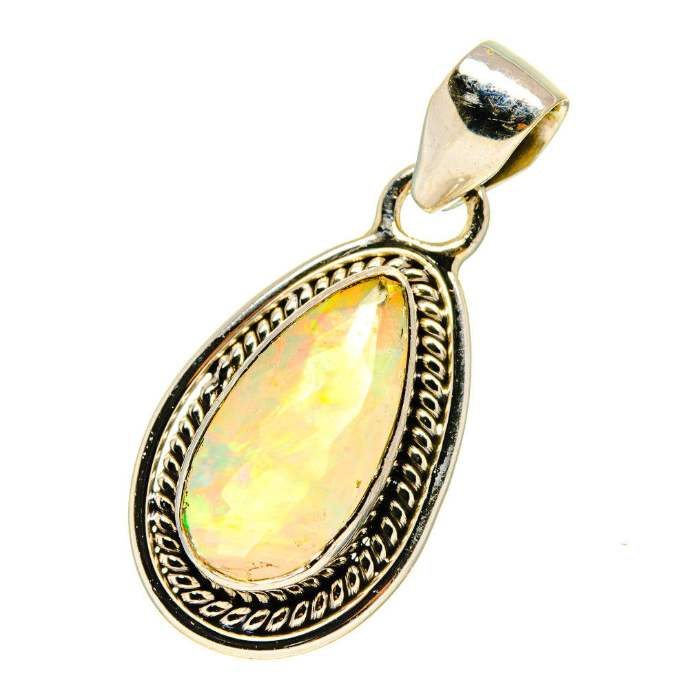 925 sterling silver teardrop opal pendant with ornate bezel and faceted glow