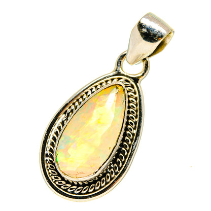 925 sterling silver teardrop opal pendant with ornate bezel and faceted glow