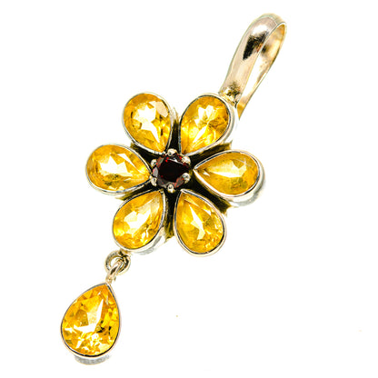 Sterling silver flower pendant with faceted yellow stones and dark center, dangling pear cut