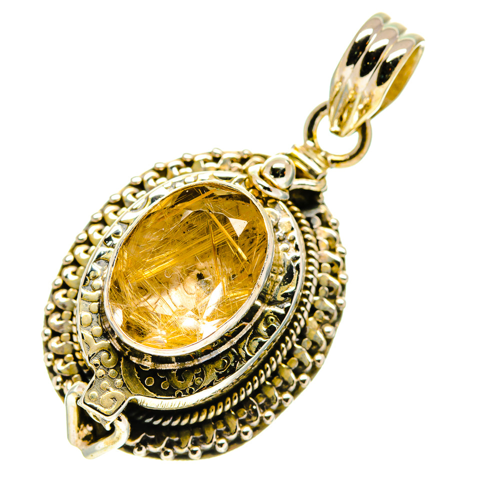 Oval golden rutilated quartz pendant with filigree silver surround and round bail