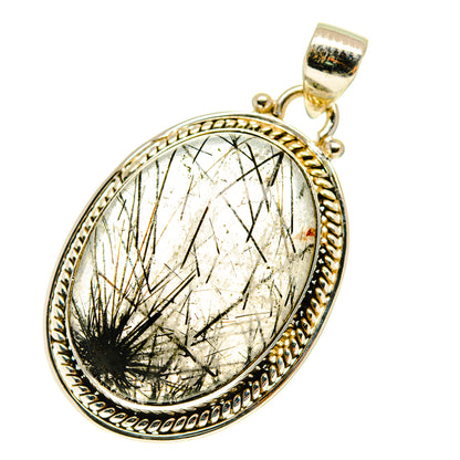 Oval tourmalinated quartz pendant in gold-tone sterling silver frame, loop bail.