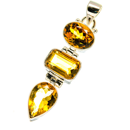 Citrine and sterling silver pendant with three faceted stones in bezel settings