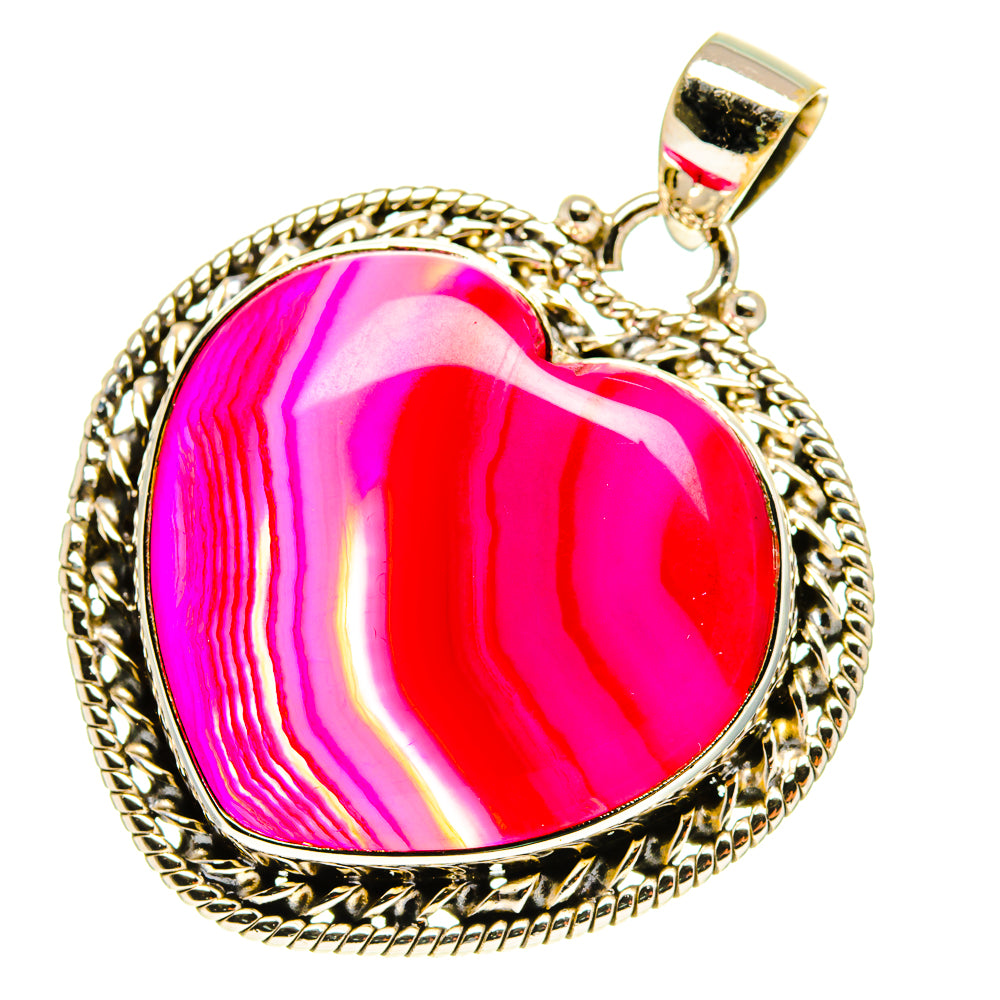 Heart-shaped pink Botswana agate pendant in gold-tone silver bezel with bail