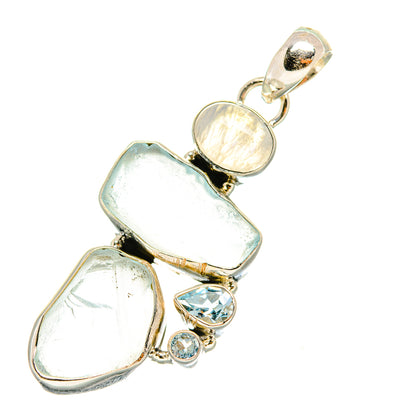Rough aquamarine and blue gemstone pendant in sterling silver, with small round stones