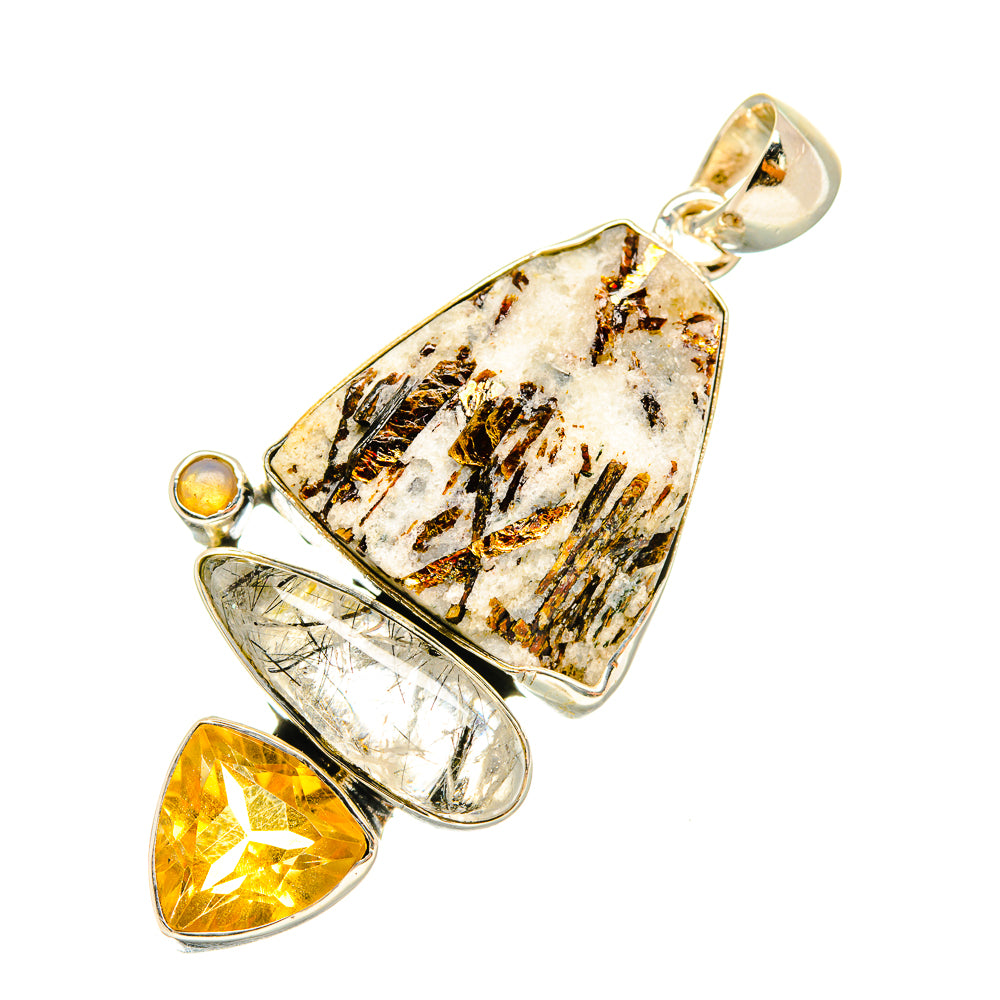 Sterling silver pendant with rough white center, yellow teardrop, and oval clear stone.