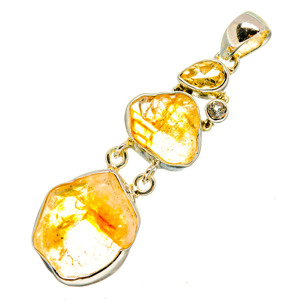 Sterling silver citrine pendant with two rough yellow-orange stones, chain links, and round detail